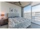 Cozy bedroom with plush bedding, a ceiling fan, and natural light from large windows at 400 W Peachtree Nw St # 3412, Atlanta, GA 30308