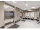 Elevator lobby with stainless steel elevators, modern lighting, tile floors and bench seating in upscale urban setting at 400 W Peachtree Nw St # 3412, Atlanta, GA 30308