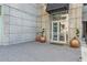 Condominium entrance featuring stone block facade with potted topiary and doorway at 400 W Peachtree Nw St # 3412, Atlanta, GA 30308