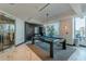 A modern game room is decorated with black wood paneling, a pool table and elegant light fixtures at 400 W Peachtree Nw St # 3412, Atlanta, GA 30308