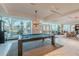A contemporary community game room features a pool table and seating area at 400 W Peachtree Nw St # 3412, Atlanta, GA 30308