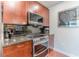 A kitchen featuring stainless steel appliances and dark subway tile backsplash at 400 W Peachtree Nw St # 3412, Atlanta, GA 30308
