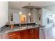 Well-appointed kitchen with stainless steel appliances, granite counters, tile backsplash, and wood floors at 400 W Peachtree Nw St # 3412, Atlanta, GA 30308