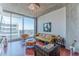 Bright living room with floor to ceiling windows and stylish decor with a view of the city at 400 W Peachtree Nw St # 3412, Atlanta, GA 30308