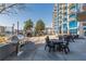Outdoor patio area with a grill, seating, and lush landscaping, perfect for barbecues and enjoying the outdoors at 400 W Peachtree Nw St # 3412, Atlanta, GA 30308