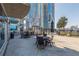 Outdoor patio with a grill, dining tables, and views of the city, offering a relaxing and social gathering space at 400 W Peachtree Nw St # 3412, Atlanta, GA 30308