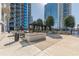 The outdoor patio space features ample seating, decorative stone planters and mature landscaping in an upscale urban setting at 400 W Peachtree Nw St # 3412, Atlanta, GA 30308