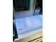 Open refrigerator drawer containing craft ice and mini cubed ice at 400 W Peachtree Nw St # 3412, Atlanta, GA 30308