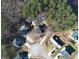 Aerial view showcasing the home's location within a cul-de-sac and mature trees at 410 Invector Ct, Locust Grove, GA 30248