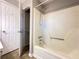 Bathroom with shower, tub and closet with shelving for optimal storage convenience at 410 Invector Ct, Locust Grove, GA 30248