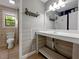 Bathroom features white-washed shiplap walls, decorative shelving and a modern vanity sink at 410 Invector Ct, Locust Grove, GA 30248