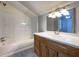 Bathroom featuring a vanity with a sink, mirror, and a shower/tub combo at 410 Invector Ct, Locust Grove, GA 30248