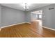 Bright dining room with hardwood floors, neutral walls, and seamless transitions to other rooms at 410 Invector Ct, Locust Grove, GA 30248