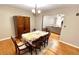 Inviting dining room area showcasing a dining table, chairs, and ample space for entertaining guests at 410 Invector Ct, Locust Grove, GA 30248
