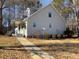 Charming home with sidewalk and cozy exterior, featuring a landscaped yard with driveway at 410 Invector Ct, Locust Grove, GA 30248