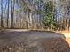 Exterior view showcasing a private driveway with stone accents at 410 Invector Ct, Locust Grove, GA 30248
