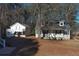Home showcasing a charming exterior with a guest house, perfect for in-laws at 410 Invector Ct, Locust Grove, GA 30248