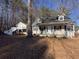 Quaint home featuring a covered front porch and adjacent guest house at 410 Invector Ct, Locust Grove, GA 30248