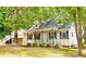 Inviting home featuring a cozy front porch and classic design at 410 Invector Ct, Locust Grove, GA 30248