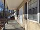 Covered front porch providing a welcoming entryway into the house at 410 Invector Ct, Locust Grove, GA 30248