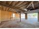 Spacious garage with wood paneled walls and a sturdy work bench at 410 Invector Ct, Locust Grove, GA 30248