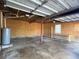 View of the garage with room for storage and a window at 410 Invector Ct, Locust Grove, GA 30248