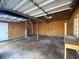 Interior view of the garage with a workbench and ample space at 410 Invector Ct, Locust Grove, GA 30248