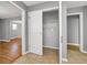 Hallway featuring tiled floors, storage closet, and seamless transitions to other rooms at 410 Invector Ct, Locust Grove, GA 30248