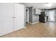 Modern kitchen featuring stainless steel appliances, tiled floors, and ample cabinet space at 410 Invector Ct, Locust Grove, GA 30248
