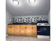 Compact kitchenette featuring cabinets, a sink, and black appliances at 410 Invector Ct, Locust Grove, GA 30248