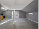 Open living area with carpet, natural light and adjoining kitchen at 410 Invector Ct, Locust Grove, GA 30248