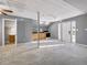 Open living area with carpet, natural light and adjoining kitchen and bathroom at 410 Invector Ct, Locust Grove, GA 30248