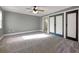 Large main bedroom with natural light, closet, and ensuite bathroom with neutral carpeting at 410 Invector Ct, Locust Grove, GA 30248