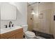 Modern bathroom featuring a glass shower, wood-paneled walls, and sleek black fixtures at 996 Moreland Se Ave, Atlanta, GA 30316