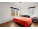 Bedroom featuring hardwood floors, a large window, and a red bedspread at 996 Moreland Se Ave, Atlanta, GA 30316