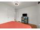 Bedroom featuring hardwood floors, a large window and a dresser with tv at 996 Moreland Se Ave, Atlanta, GA 30316
