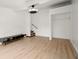 Bonus room featuring laminate floors, stairs to the lower level, and a closet at 996 Moreland Se Ave, Atlanta, GA 30316