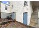 Back of house featuring basement doors, stairs, and AC units at 996 Moreland Se Ave, Atlanta, GA 30316