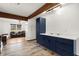 Stylish kitchen featuring stainless steel appliances, countertops, and dark blue cabinetry at 996 Moreland Se Ave, Atlanta, GA 30316