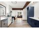 Modern kitchen featuring stainless steel appliances, white cabinets, and an open layout to the living room at 996 Moreland Se Ave, Atlanta, GA 30316