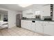 Well-maintained kitchen featuring white cabinetry, stainless steel appliances, and functional design at 996 Moreland Se Ave, Atlanta, GA 30316