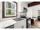 Bright kitchen featuring stainless steel appliances, undermount sink and a view to the living room at 996 Moreland Se Ave, Atlanta, GA 30316