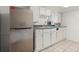 Efficient kitchen features stainless steel refrigerator and ample cabinet space at 996 Moreland Se Ave, Atlanta, GA 30316
