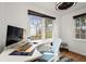 Bright office with large windows, modern desk setup, and cozy decor creating an ideal workspace at 996 Moreland Se Ave, Atlanta, GA 30316