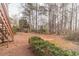 Spacious backyard with mature trees and a deck with stairs, perfect for outdoor entertaining and relaxation at 1351 Mckendree Park Ct, Lawrenceville, GA 30043