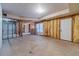 Unfinished basement ready for customization with exposed framing and walkout door at 1351 Mckendree Park Ct, Lawrenceville, GA 30043