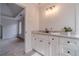 Bright bathroom featuring vanity sink and closet at 1351 Mckendree Park Ct, Lawrenceville, GA 30043