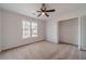 Bedroom featuring carpeting, a ceiling fan and a closet at 1351 Mckendree Park Ct, Lawrenceville, GA 30043
