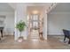 Inviting foyer with hardwood floors, crown molding, and views into adjacent dining and living spaces at 1351 Mckendree Park Ct, Lawrenceville, GA 30043