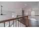 Hallway and railing that overlooks the main living area with an arched window at 1351 Mckendree Park Ct, Lawrenceville, GA 30043